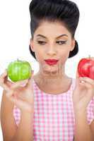 Thoughtful black hair model holding apples