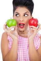 Surprised black hair model holding apples