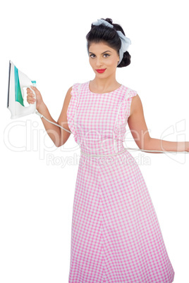 Attractive black hair model posing and holding an iron