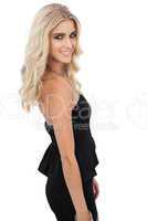 Smiling blonde model in black dress posing looking at camera