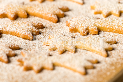 Baking christmas cookies comet star powdered sugar