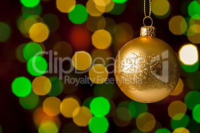 Christmas ball hanging defocused sparkling lights