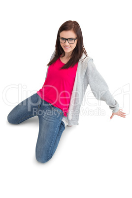 Cheerful young woman making hip hop pose