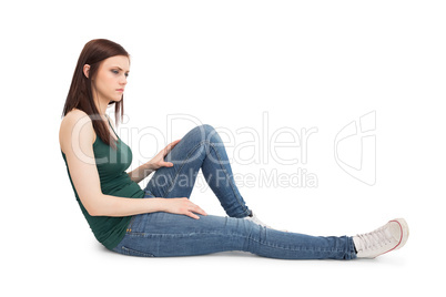 Thoughtful attractive brunette sitting