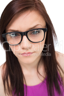 Close up on pretty brunette with glasses posing