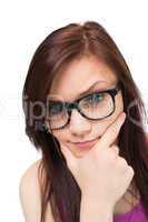 Close up on thinking brunette with glasses