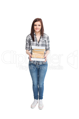 Smiling pretty student holding books