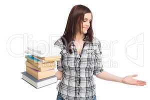 Cheerful pretty student holding pile of books