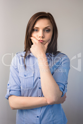 Thoughtful serious brunette posing