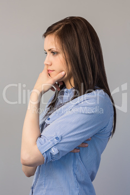 Thoughtful pretty brunette posing