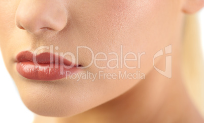 Close up on voluminous glossy lips