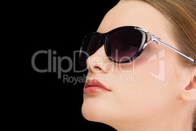 Thoughtful classy blonde wearing sunglasses