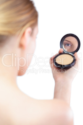 Sensual blonde model holding cosmetics