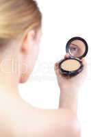 Sensual blonde model holding cosmetics