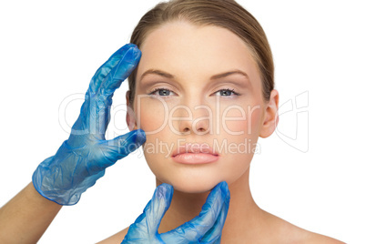 Surgeon examining pretty peaceful model