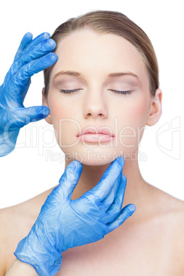 Surgeon examining relaxed cute model