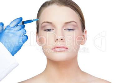 Peaceful young model having botox injection