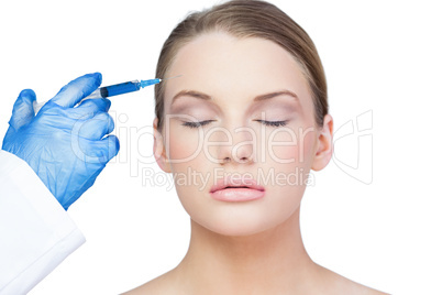 Content young model having botox injection