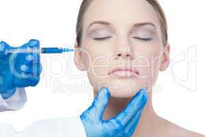 Attractive young model having botox injection on the cheek