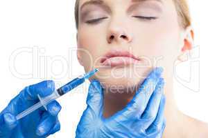 Relaxed pretty model having botox injection on the lips