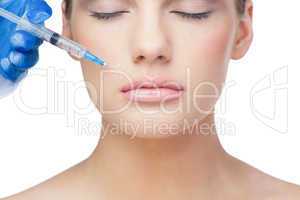 Relaxed beautiful blonde having injection above the lips