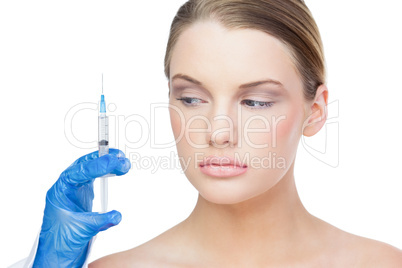 Content beautiful blonde holding surgical needle