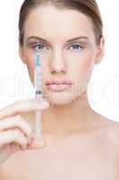 Calm pretty model holding surgical needle