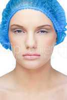 Calm pretty model wearing blue surgical cap