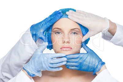 Surgeons examining calm blonde