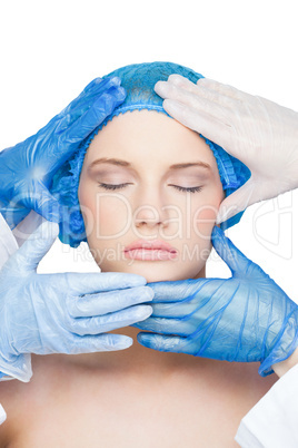 Surgeons examining content blonde