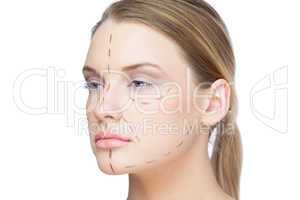 Pretty blonde woman with dotted lines on the face