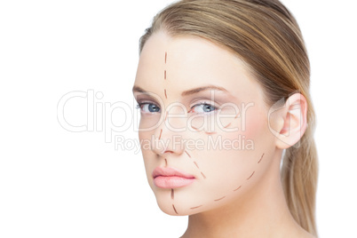 Relaxed pretty blonde with dotted lines on the face