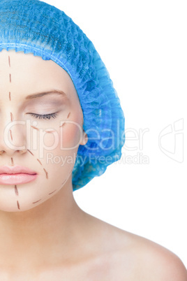 Relaxed young patient with dotted lines on the face