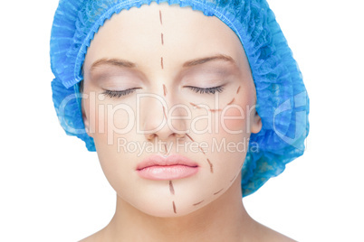 Peaceful young patient with dotted lines on the face