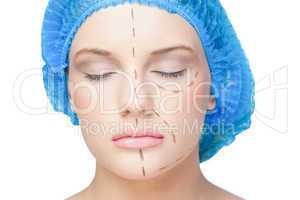 Peaceful young patient with dotted lines on the face