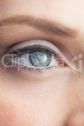 Extreme close up on gorgeous shinning blue eye