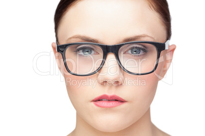 Serious natural model wearing classy glasses