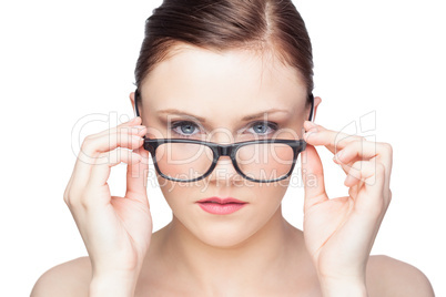 Content natural model looking over her classy glasses