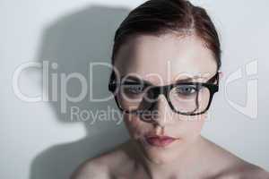 Serious clean model with classy glasses posing