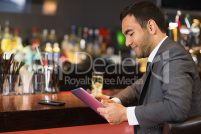 Attractive businessman sitting at bar