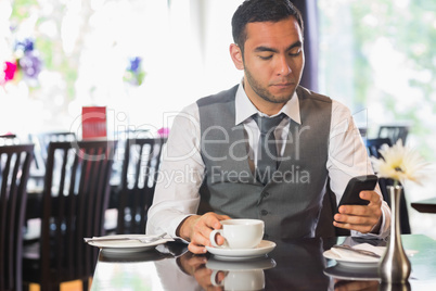 Attractive businessman sitting in restaurant