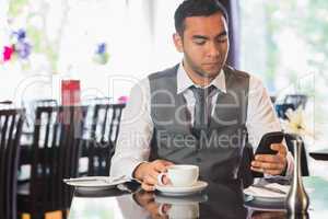 Attractive businessman sitting in restaurant