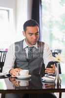 Businessman having coffee in restaurant