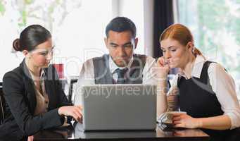 Business people working together with laptop