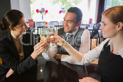 Business people celebrating a success with champagne