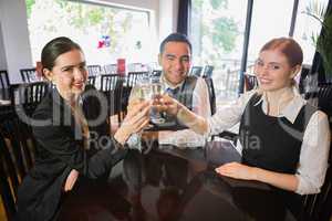 Business team celebrating a success with champagne in restaurant