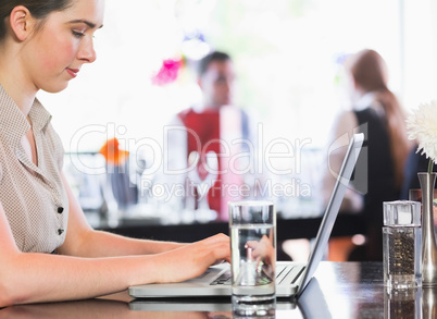 Businesswoman working on laptop