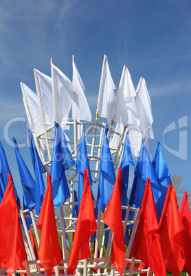 colored flags on a blue sky background