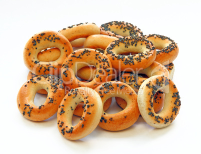 drying bagels with poppy seeds on a white background