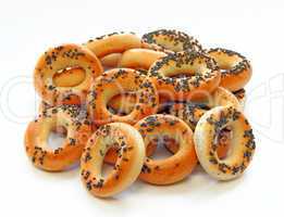 drying bagels with poppy seeds on a white background
